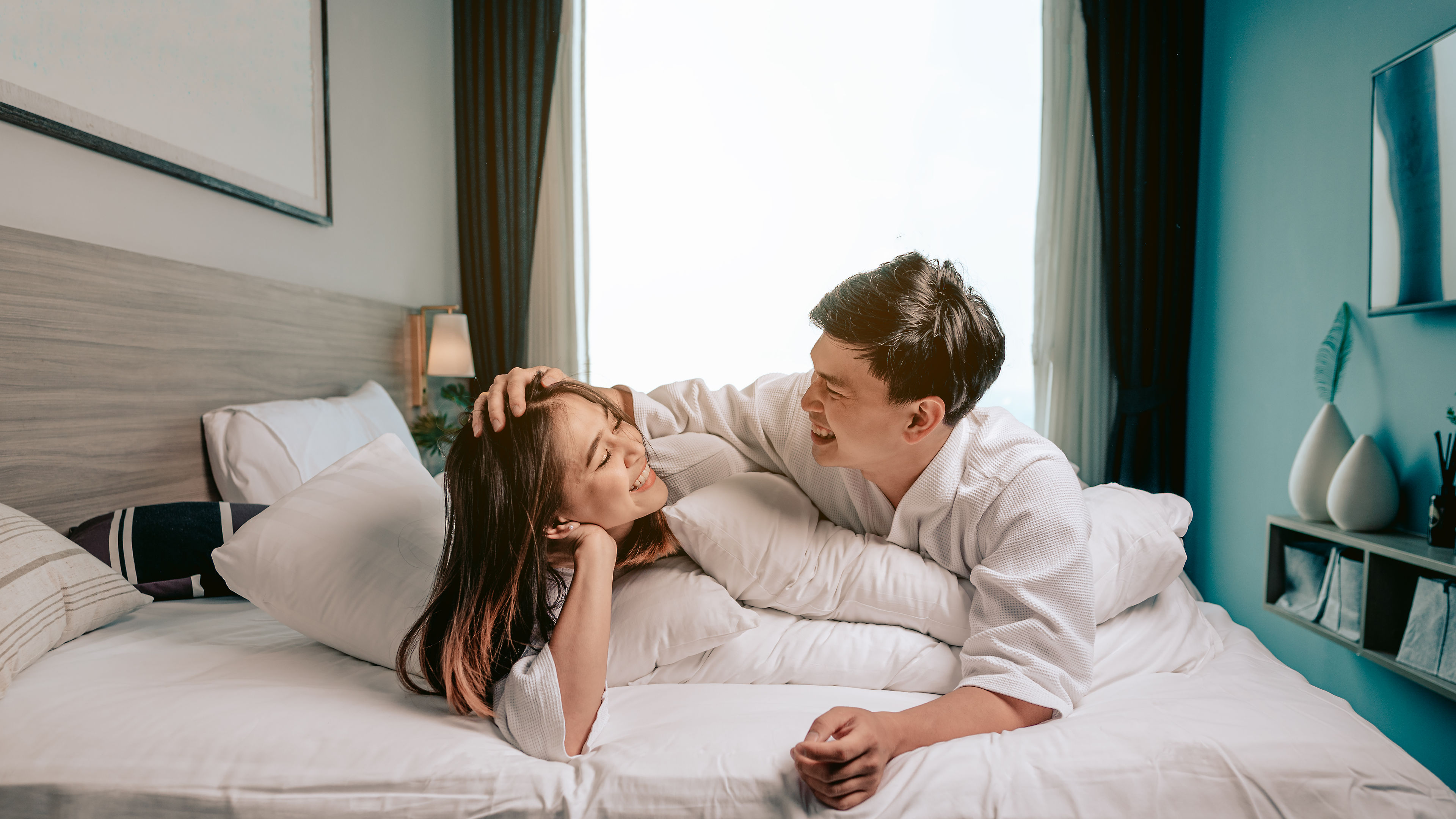 Asian couples in hotel room