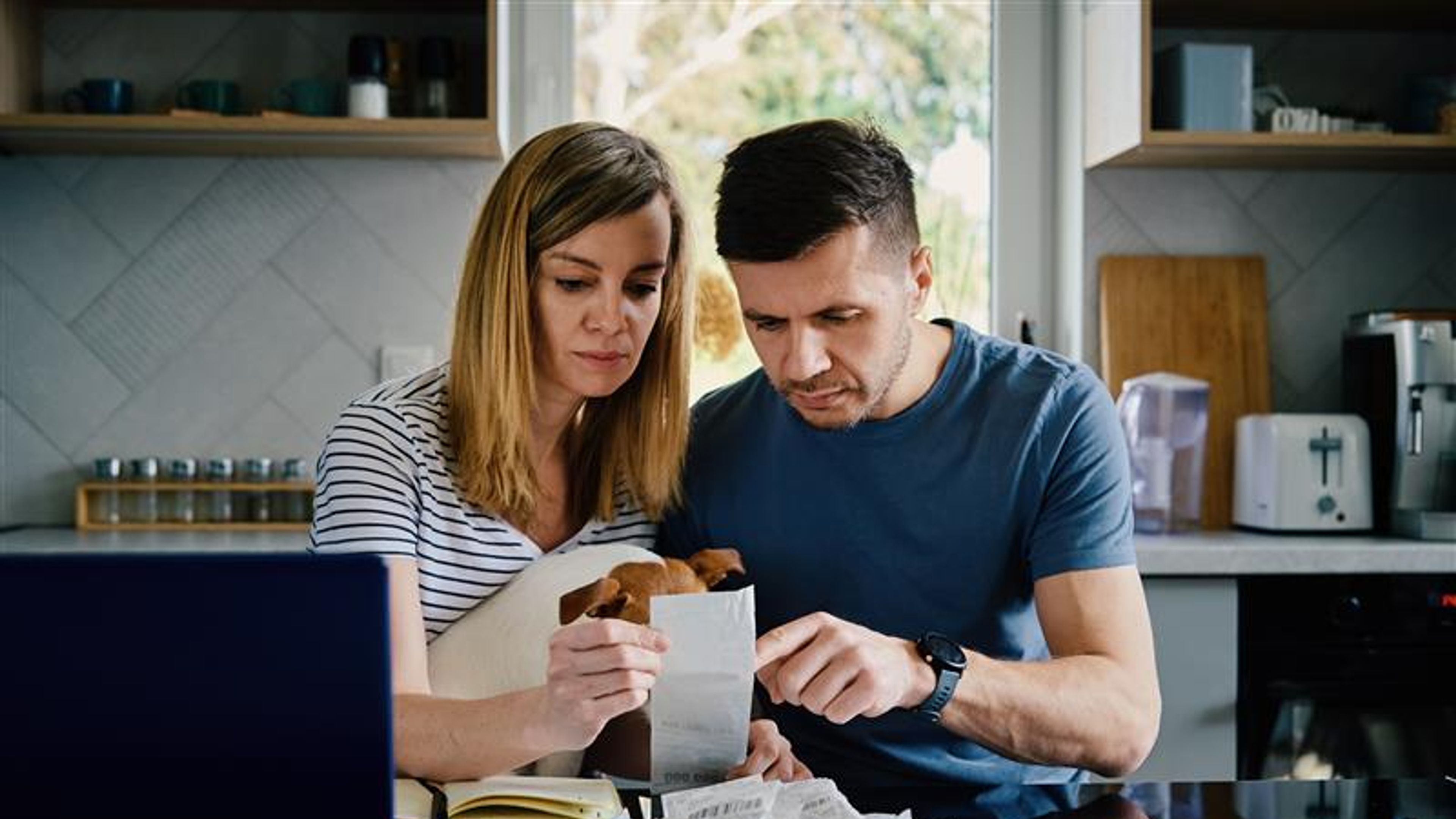 A couple looking at some bills