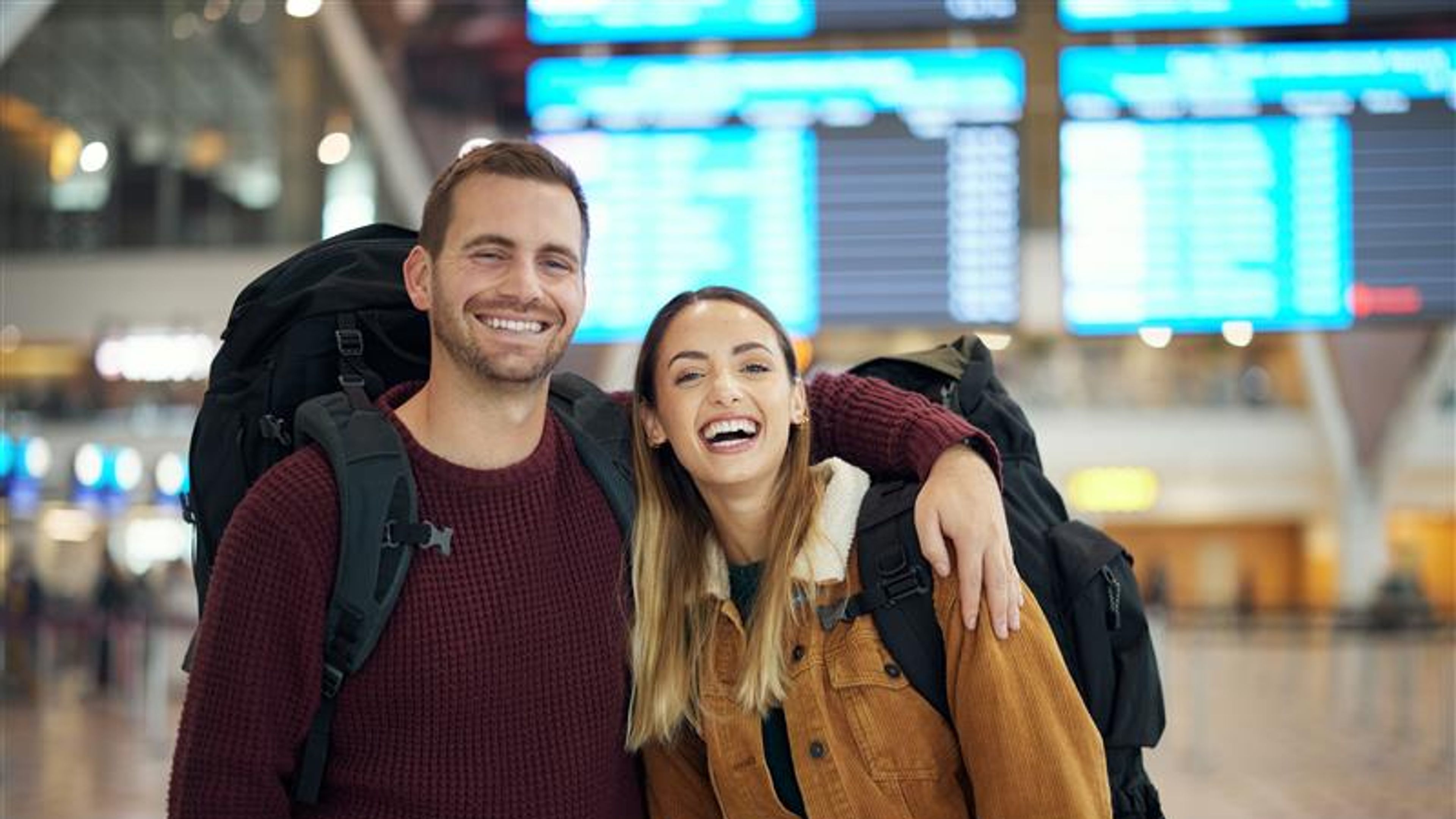 A portrait of a couple at airport