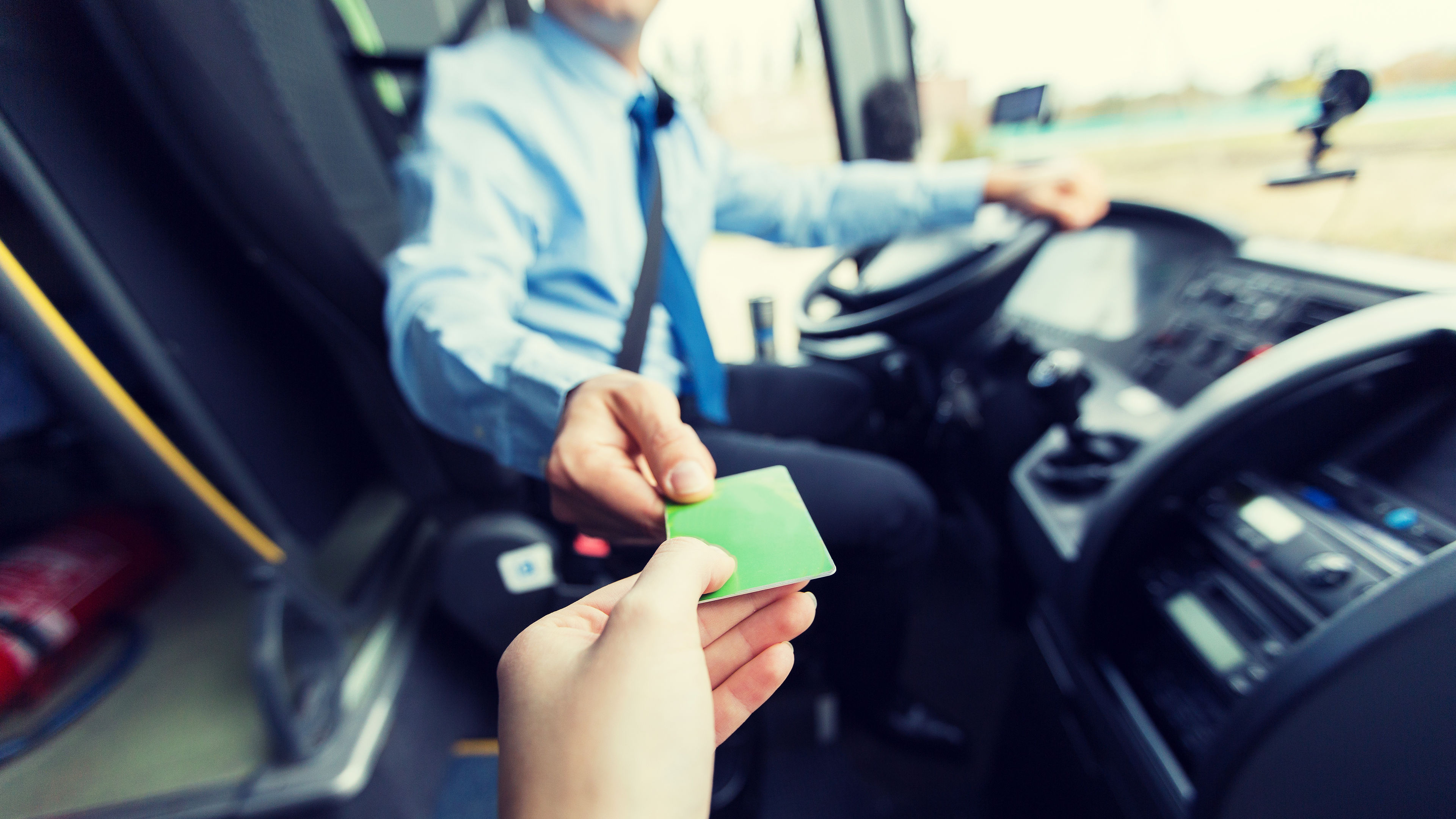 bus driver taking ticket or card from passenger 