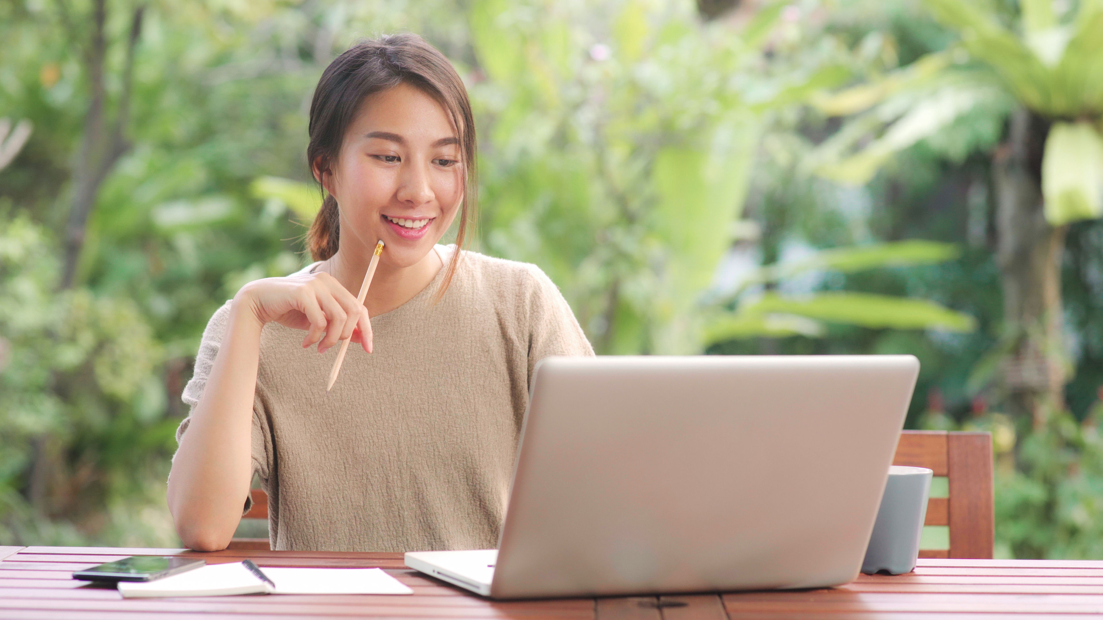 A woman looking at laptop