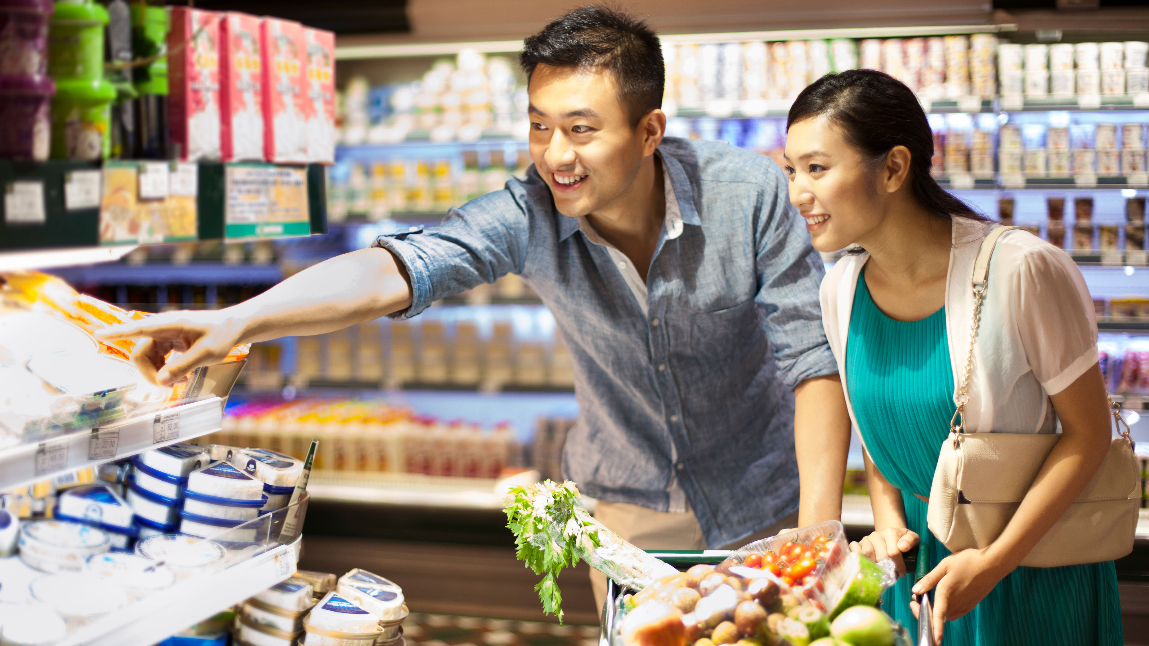 Young couple shopping in supermarket 