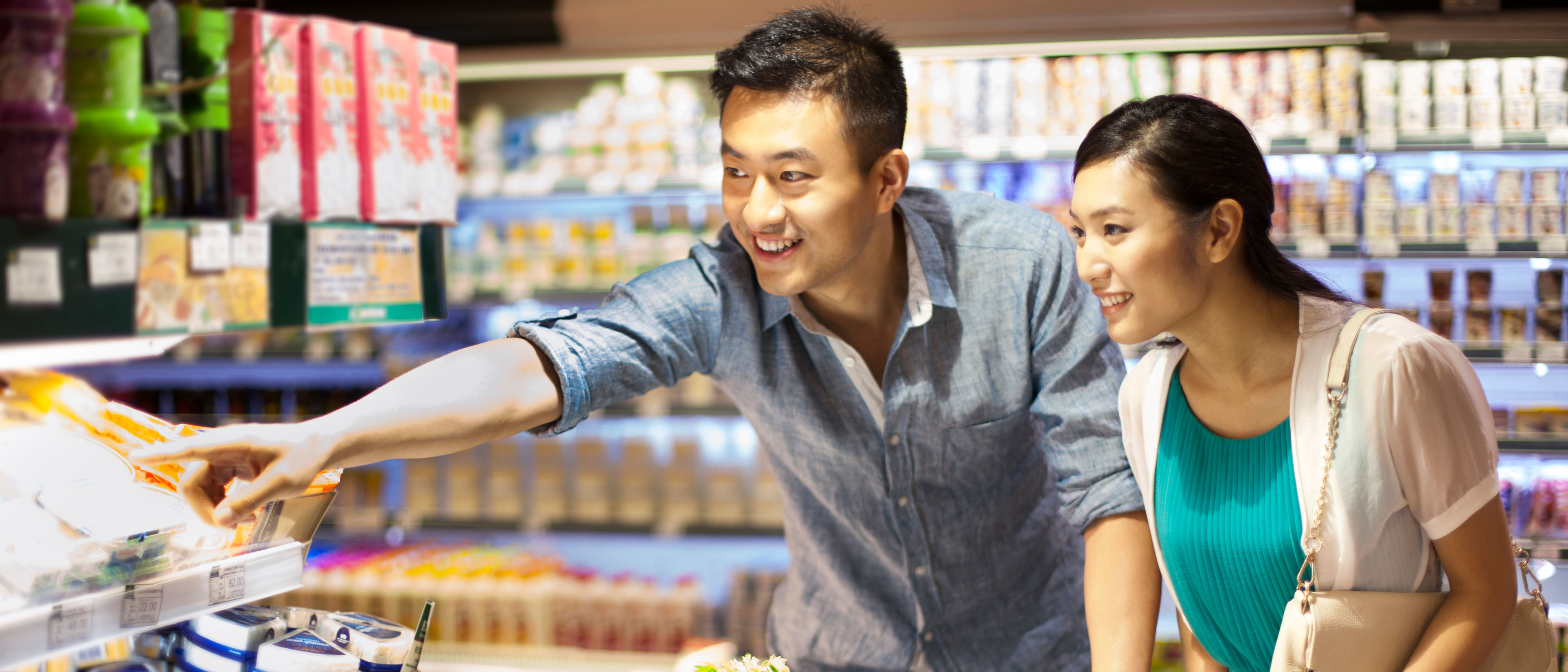 Young couple shopping in supermarket 