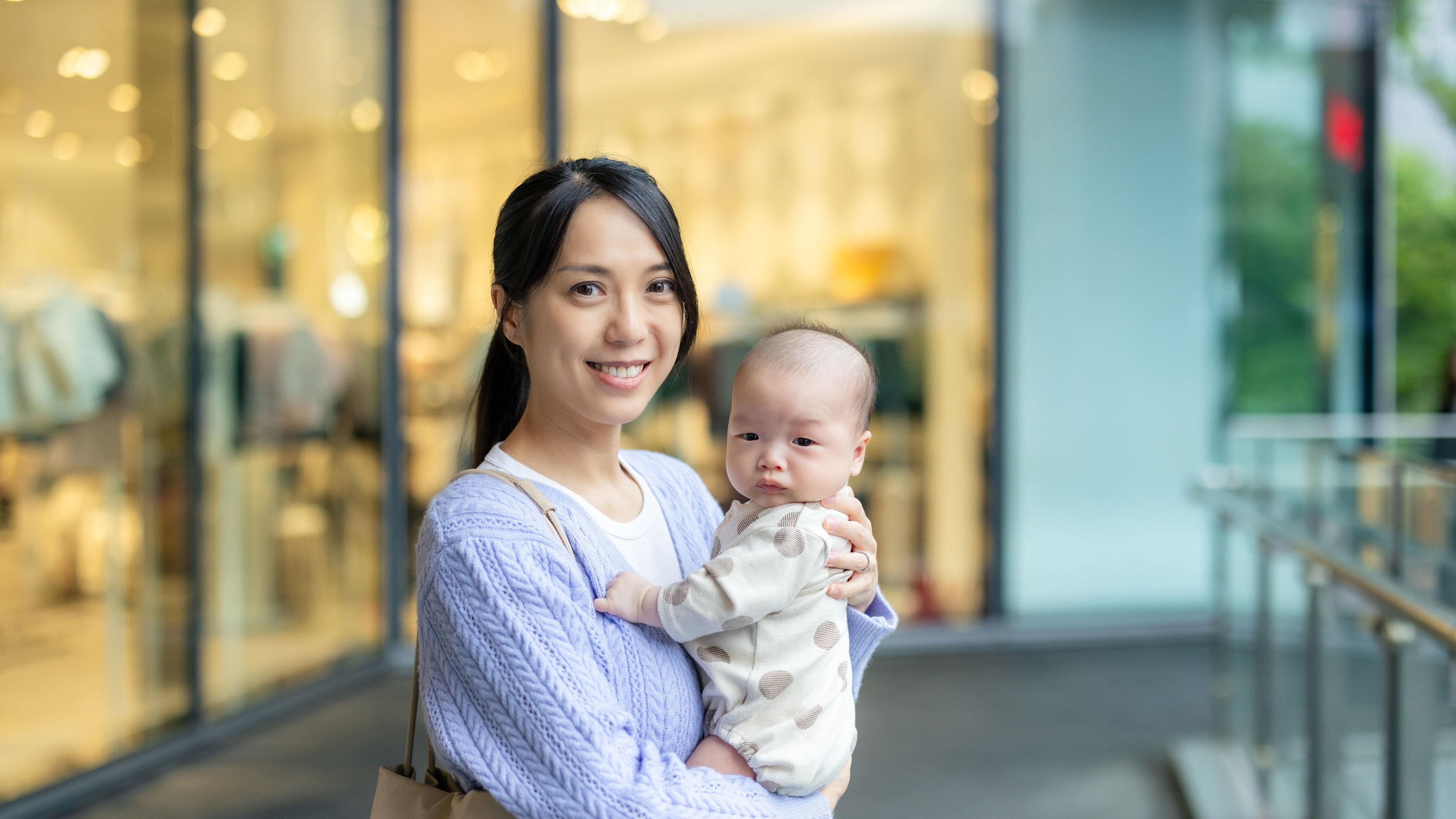  Smiling woman holding a baby