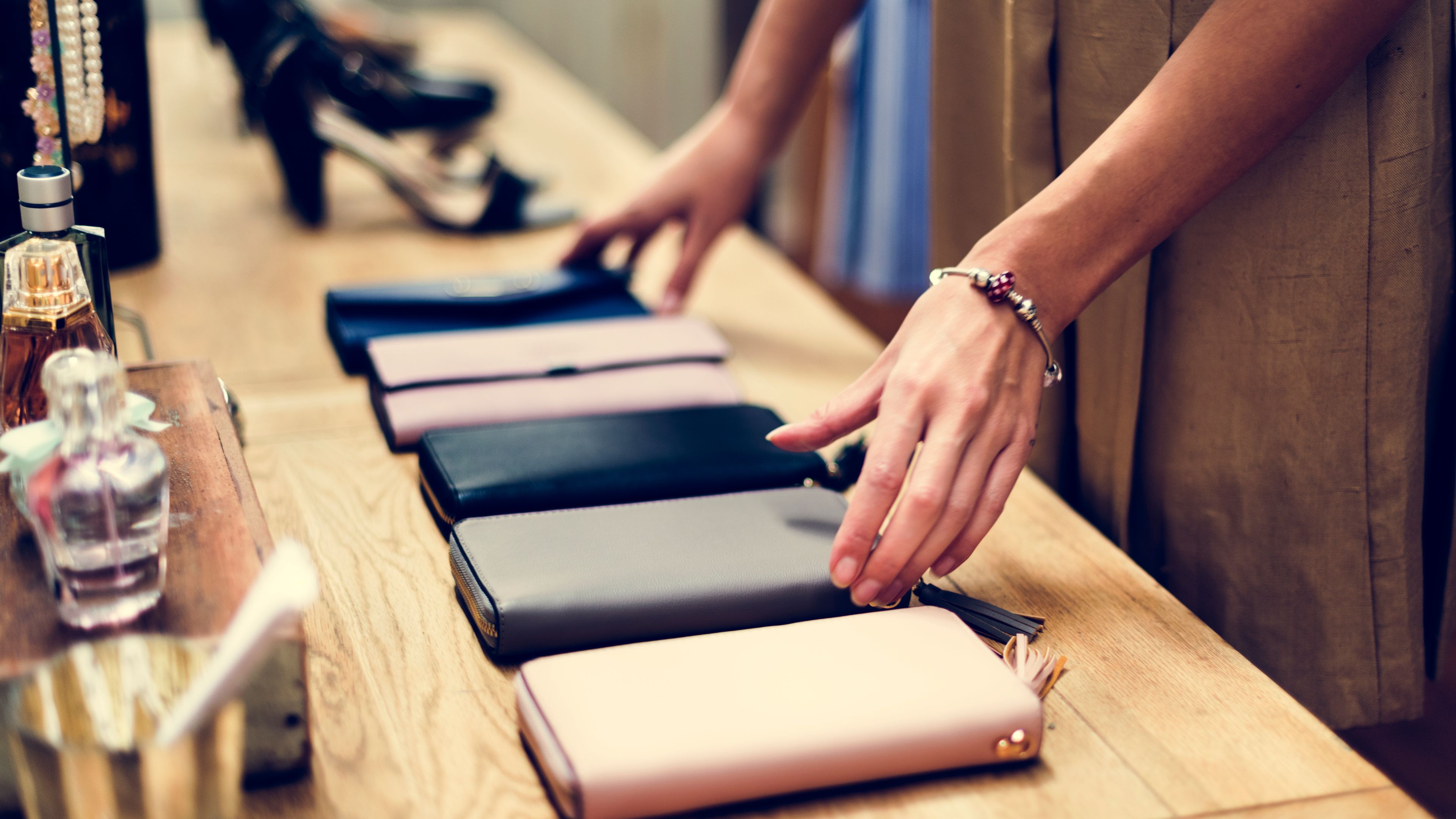 Woman adjusting purses  