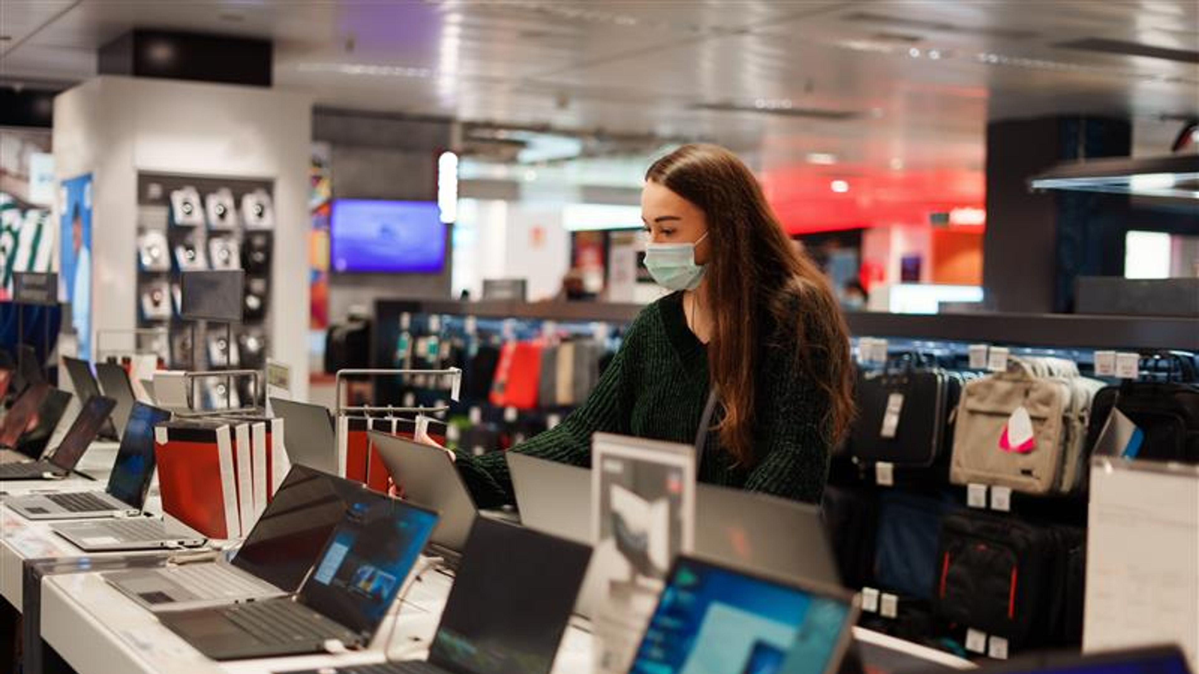 Asian girl in laptop store