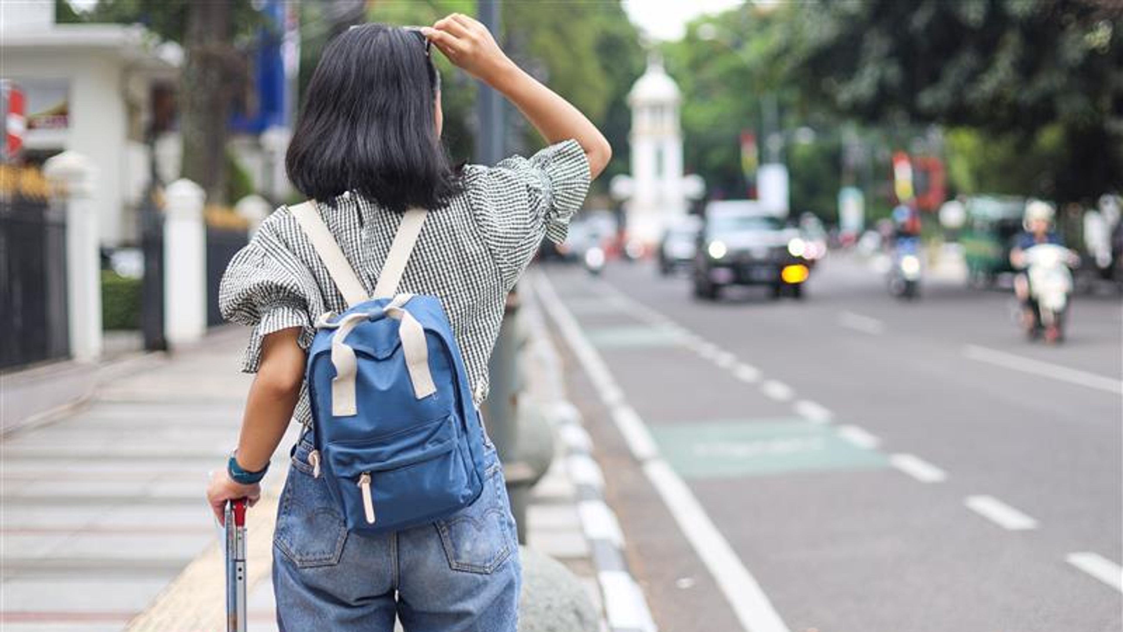 A happy woman with travel bags 