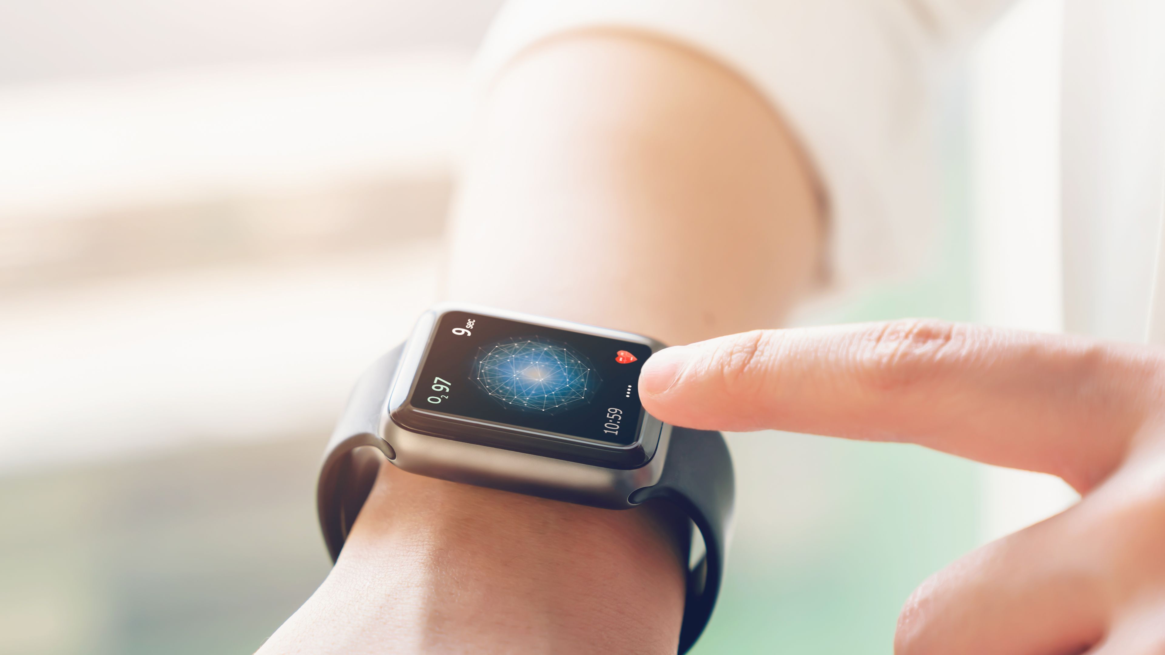 hand touching smartwatch with health app on the screen 