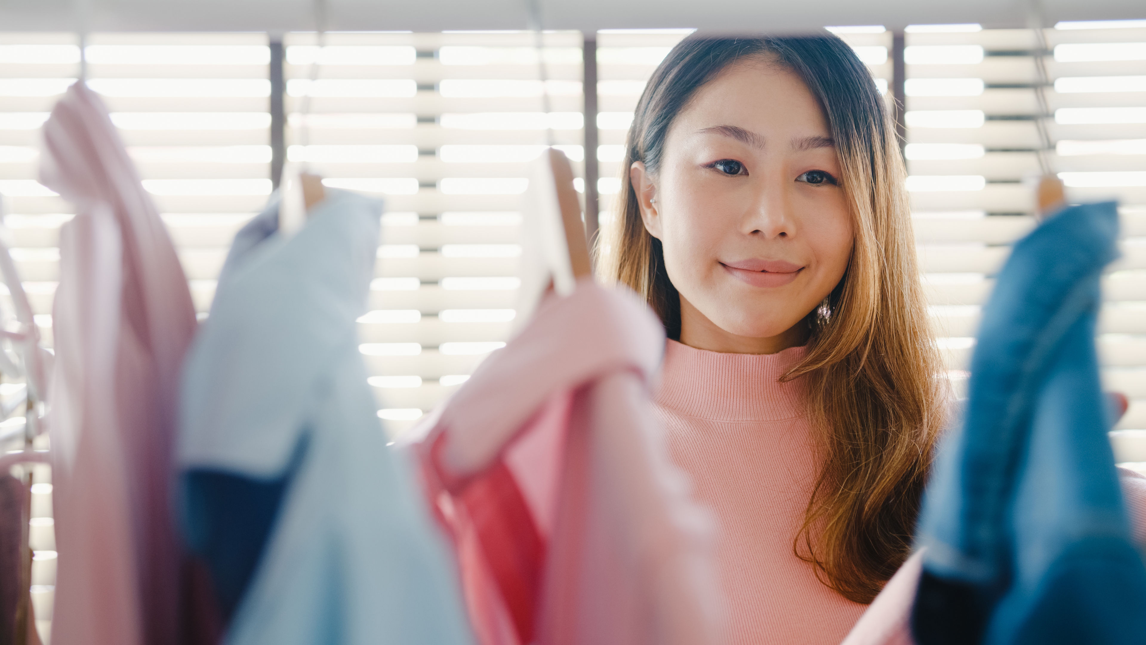 Lady choosing outfit in wardrobe 