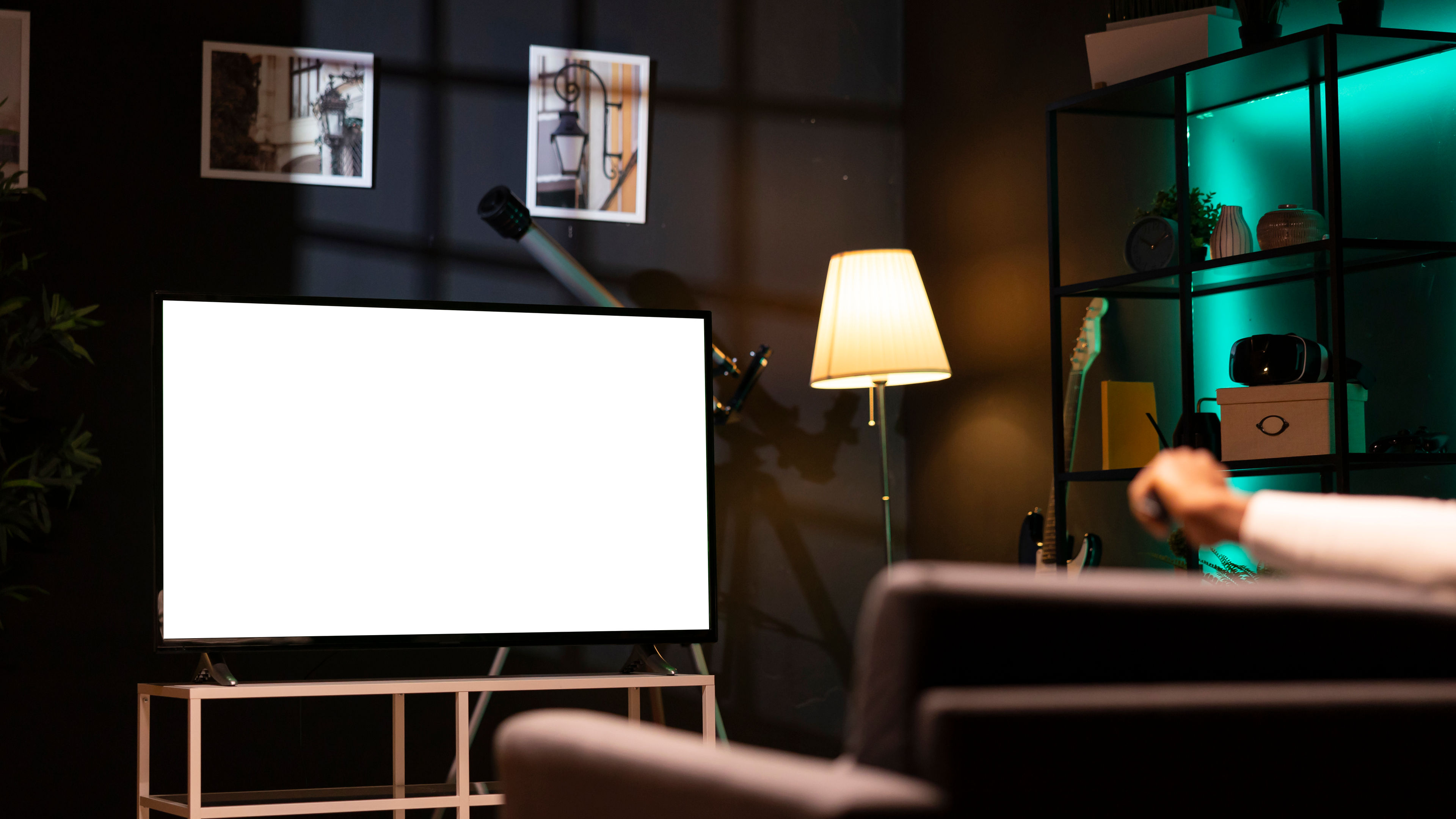 Man using streaming services on mockup TV to watch movies from the comfort of his personal cinema