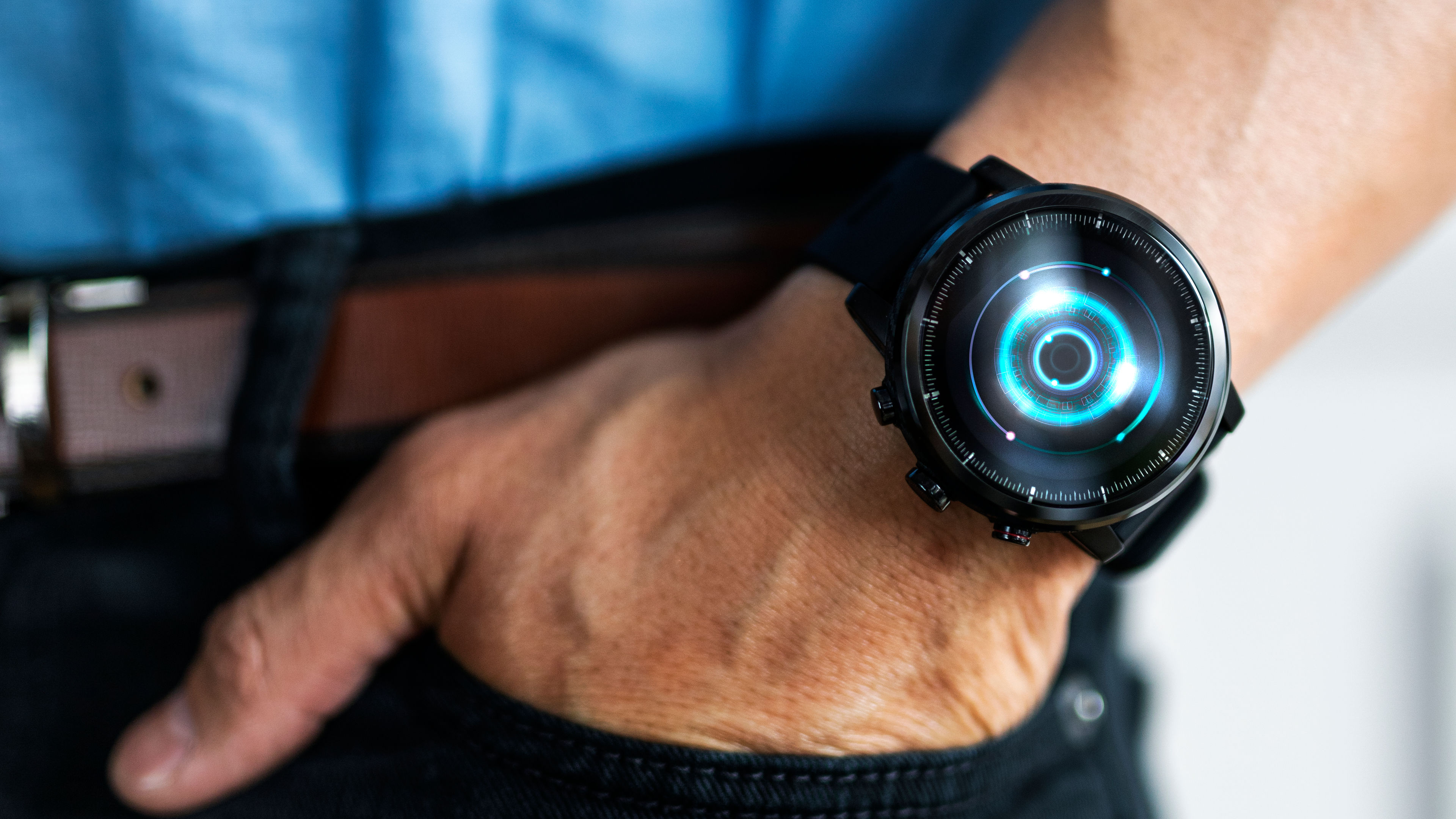 Man wearing a smartwatch with his hand inserted on his pocket 