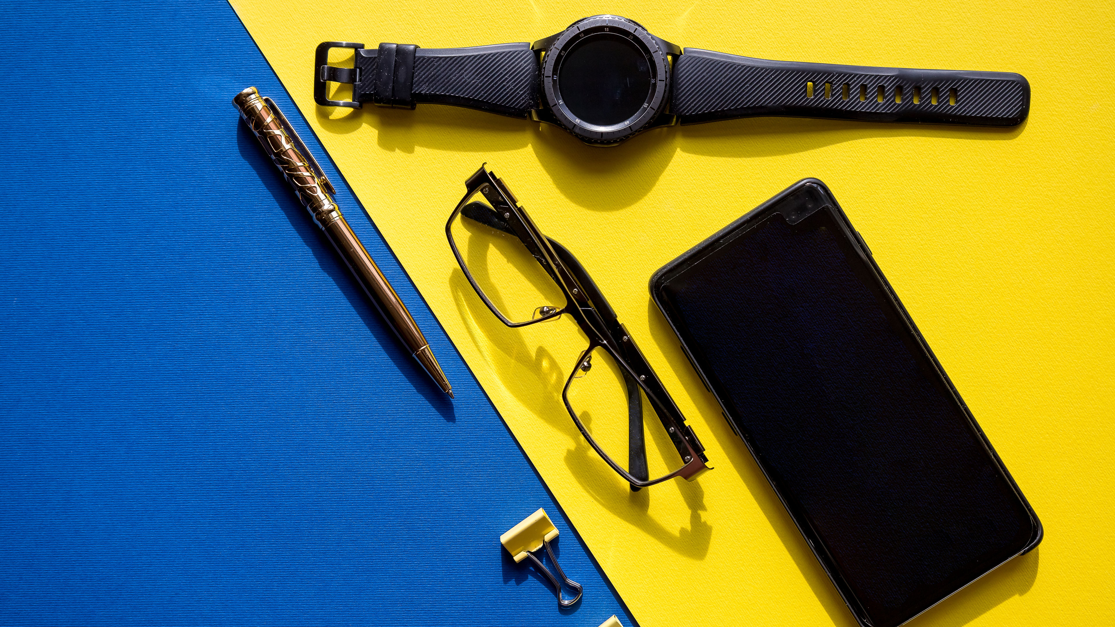 Outfit of traveler, businessman or student. Smartphone, glasses, smart watch. business desk office 