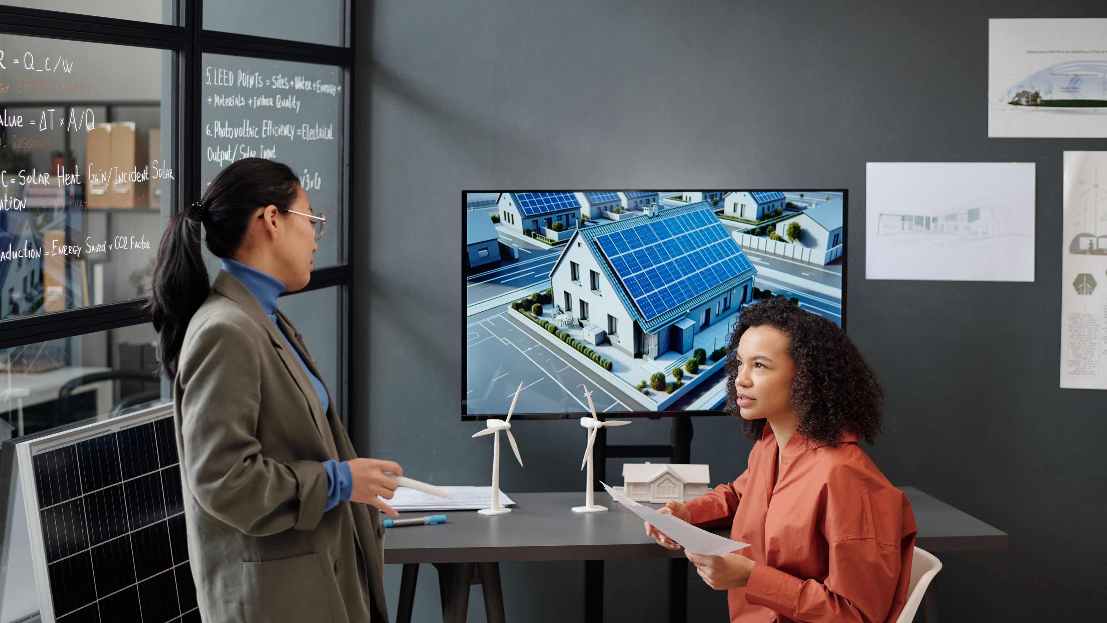 Two women preparing for presentation