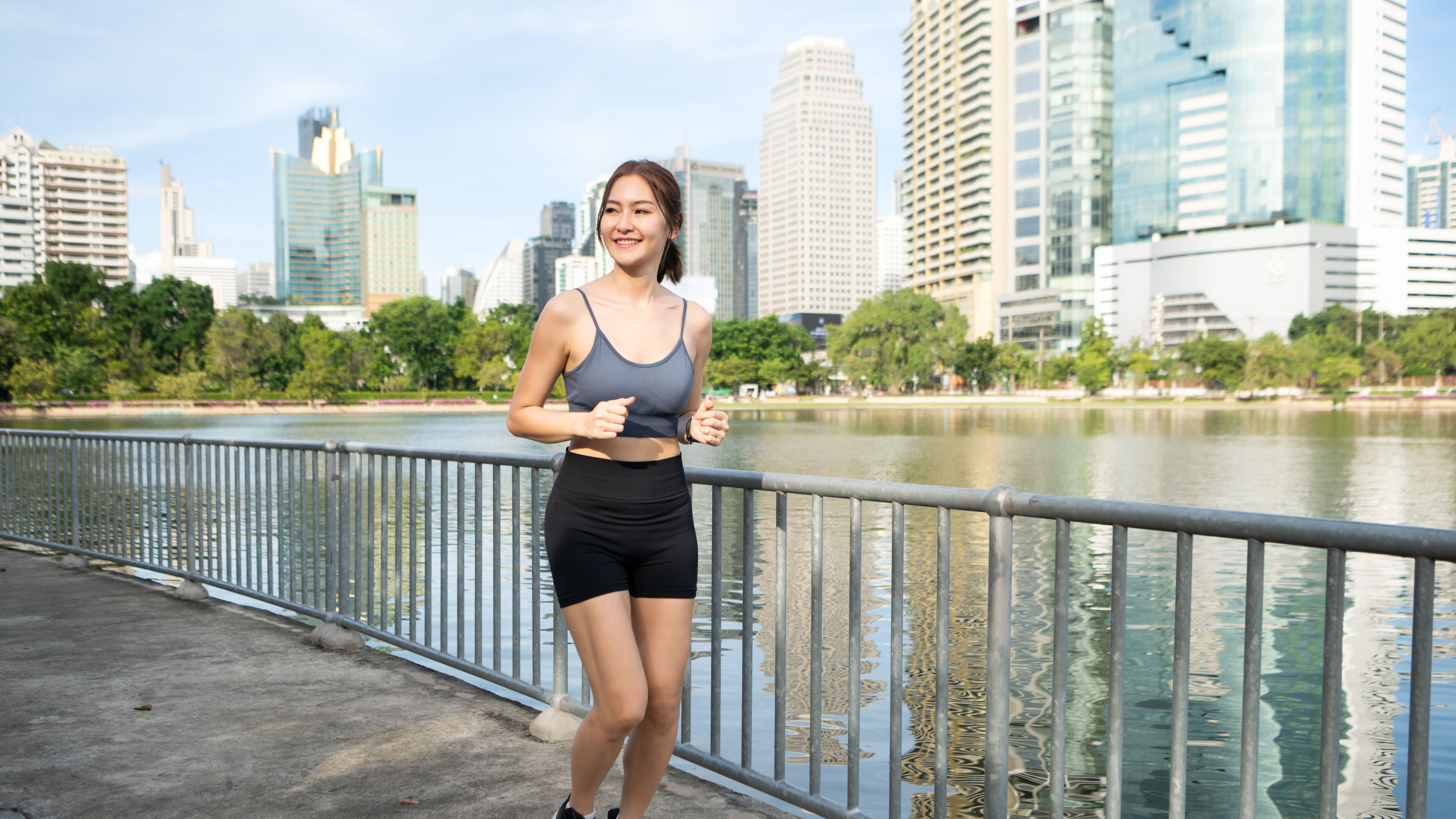 Young woman exercise time in a city park 