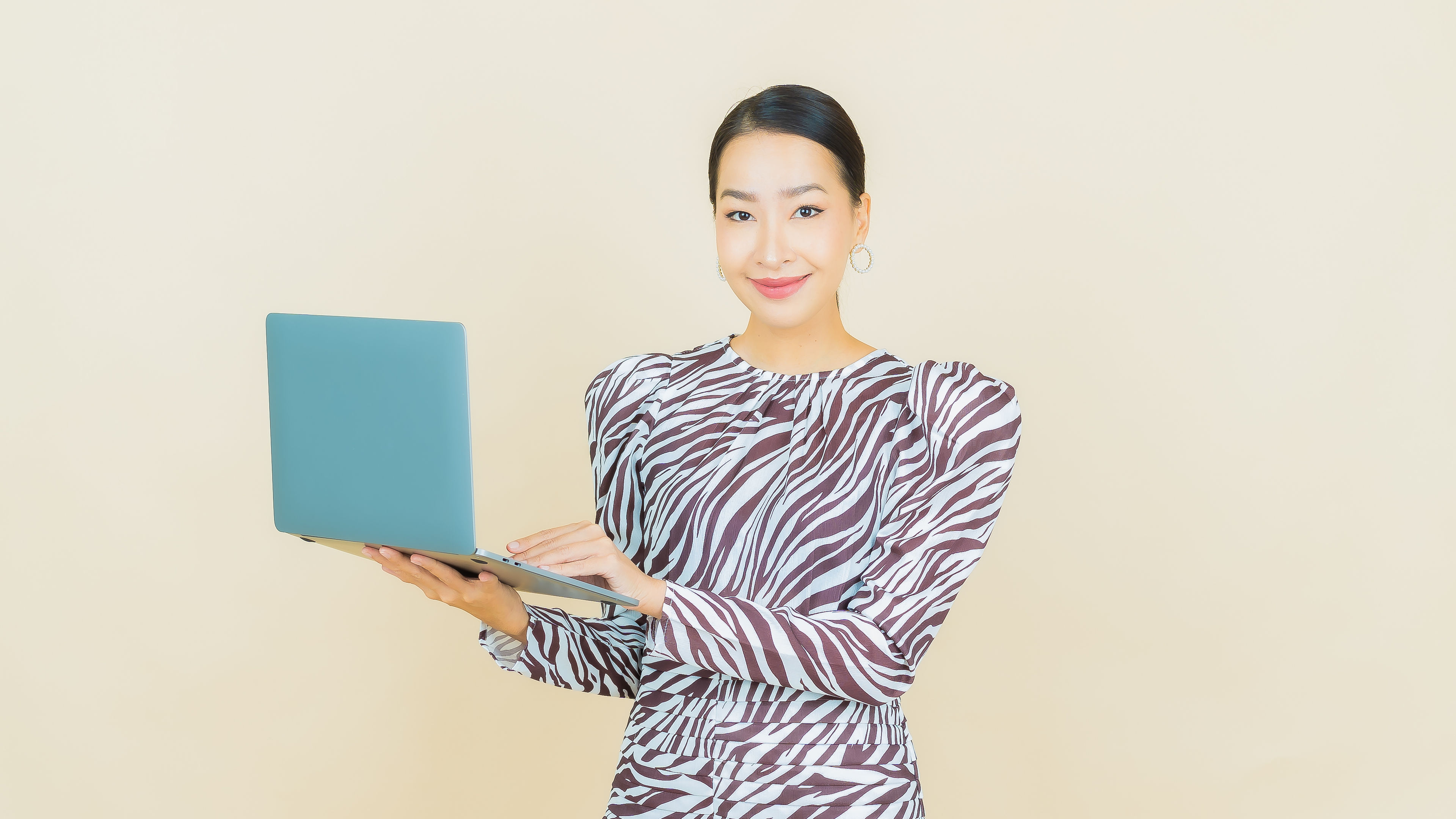 Beautiful young asian woman smile with computer laptop 