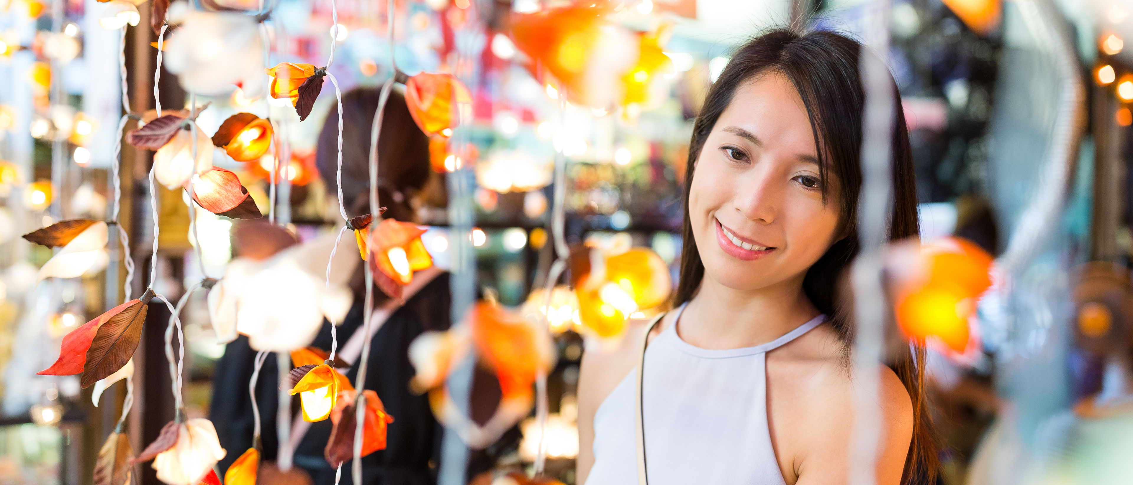 Woman choosing the decoration lamp