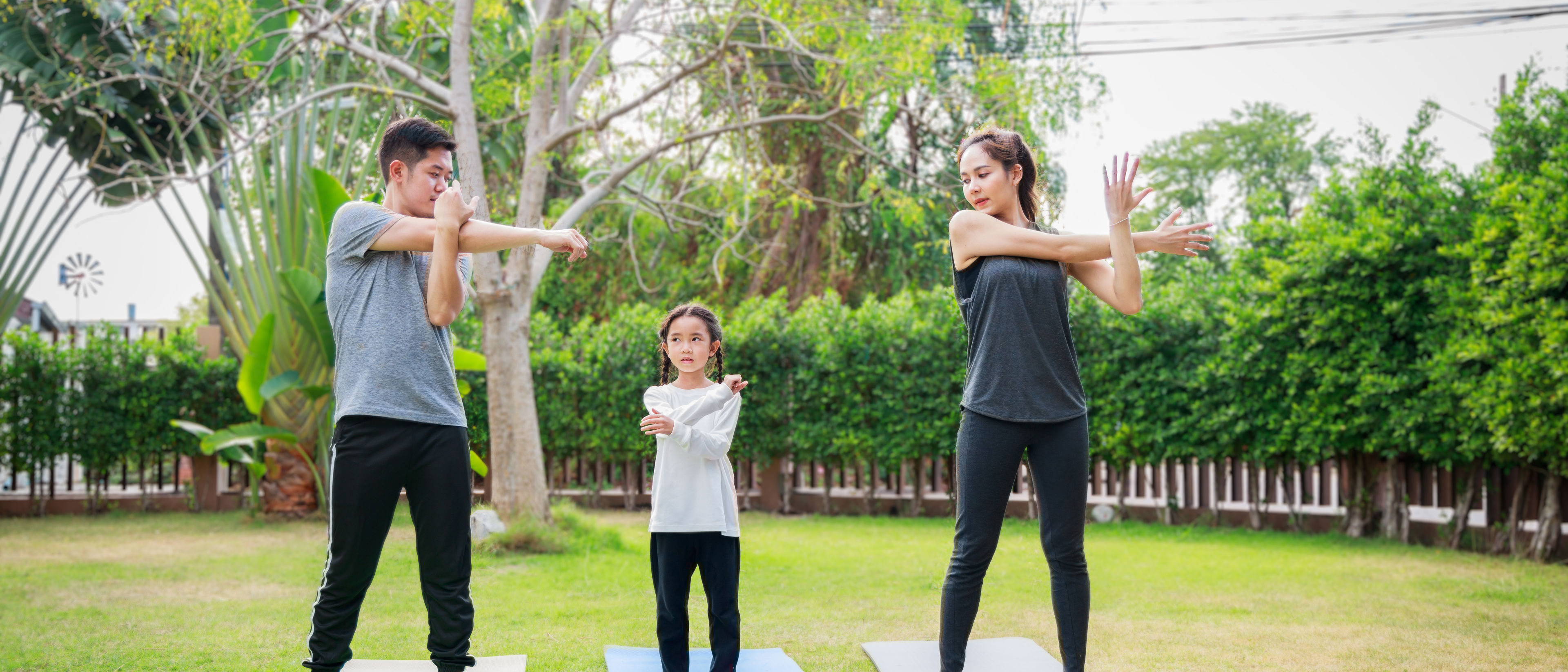 Family practicing yoga together