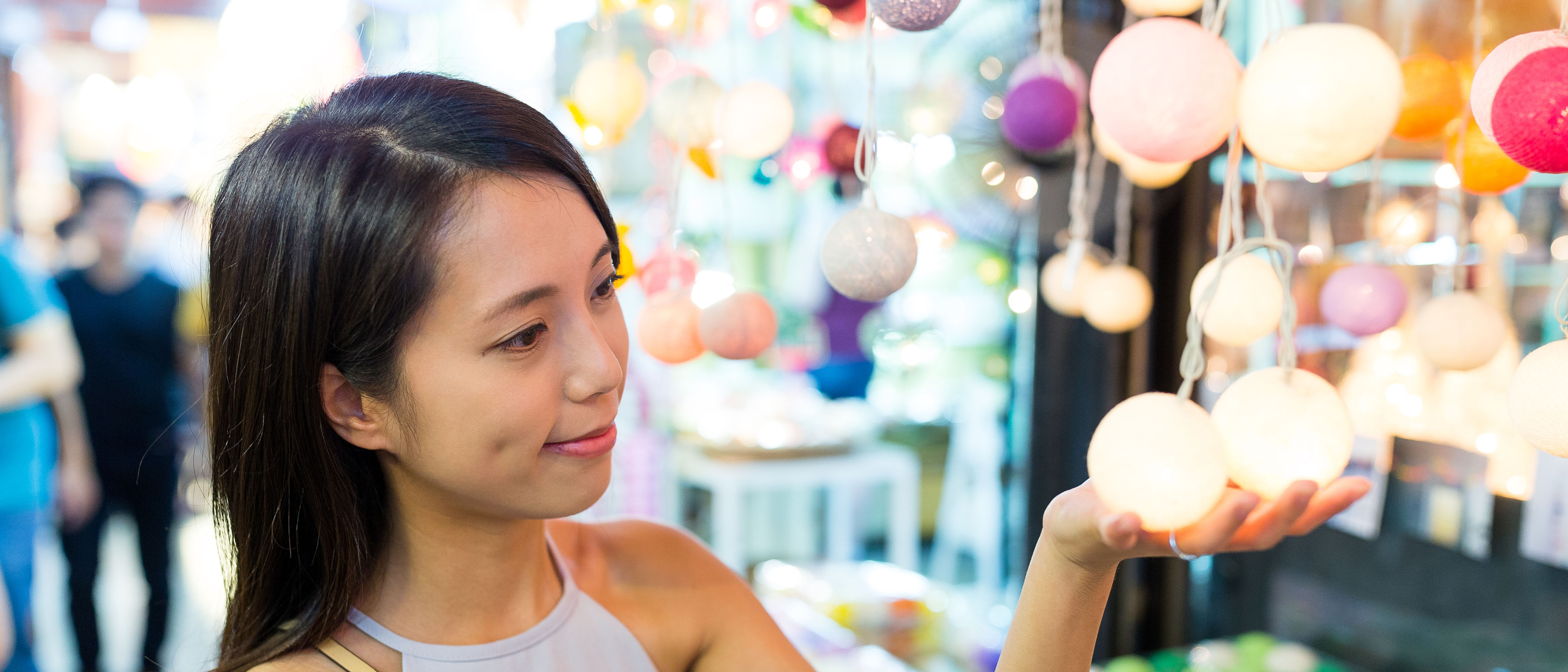 Yong woman shopping colourful lights