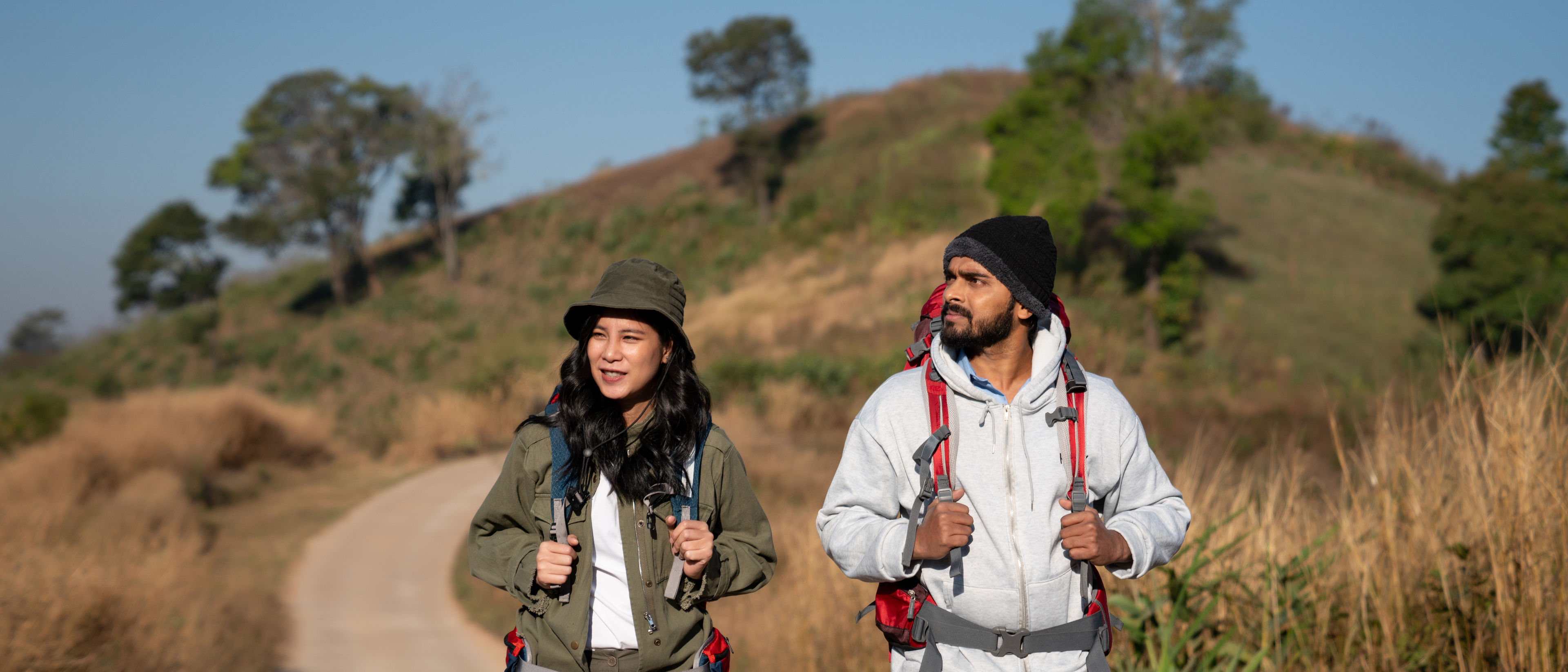 travelers hiking with backpack