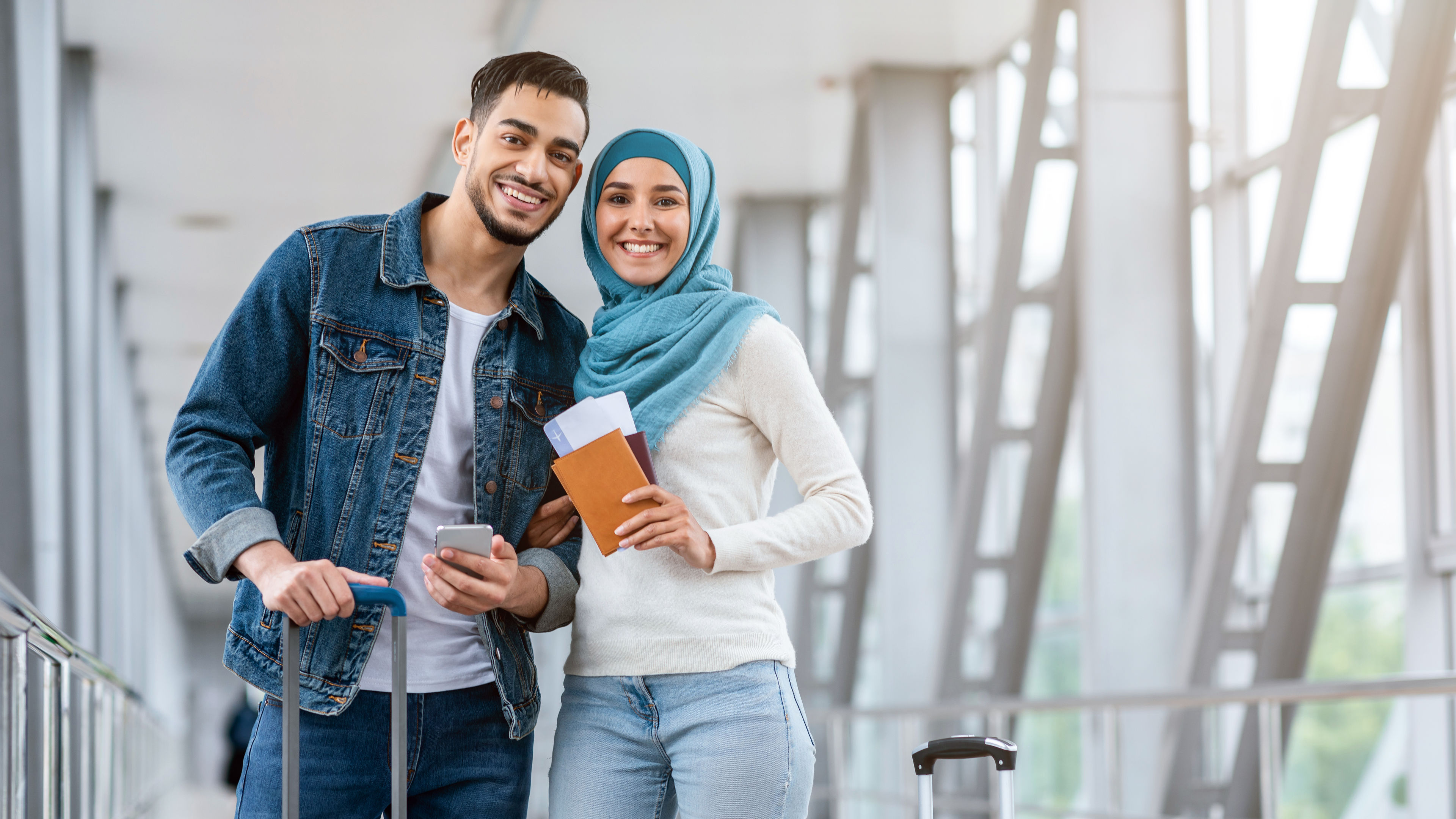 A happy couple with luggage
