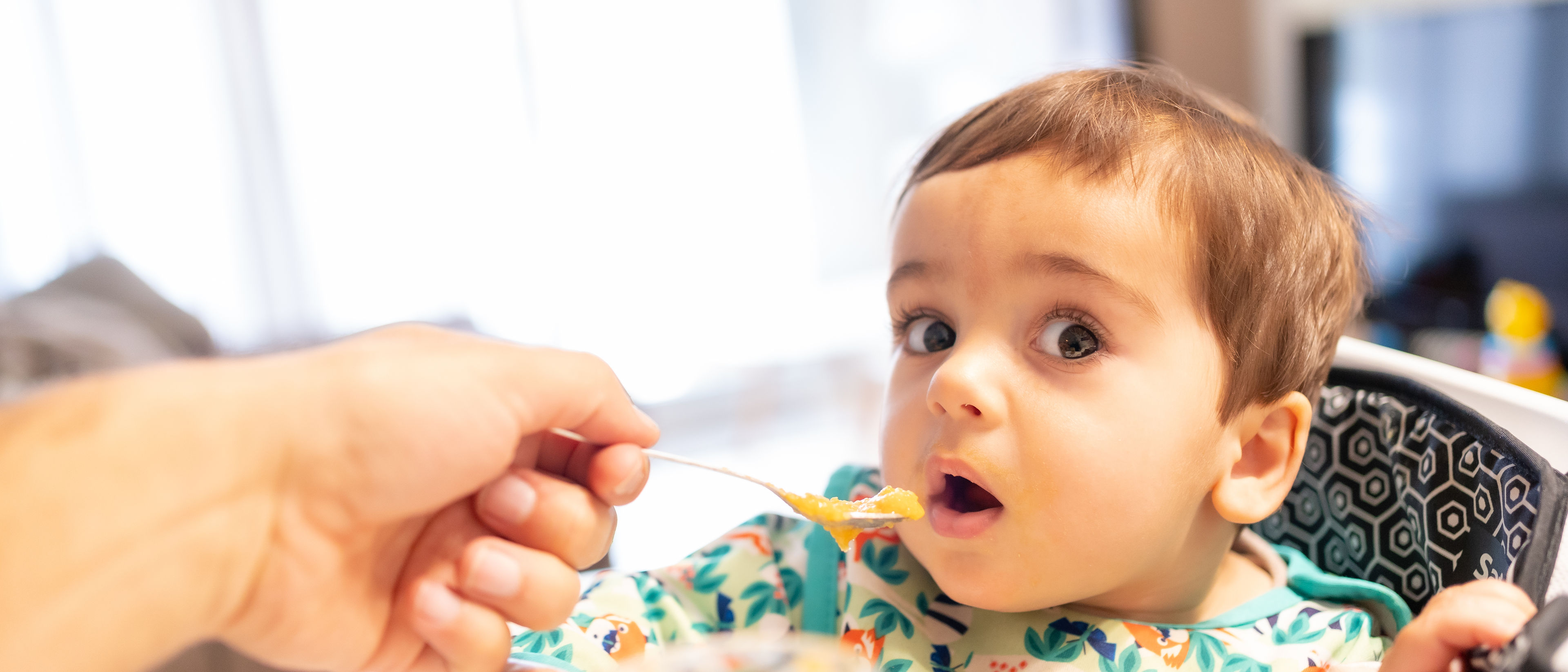 Father feeding his baby