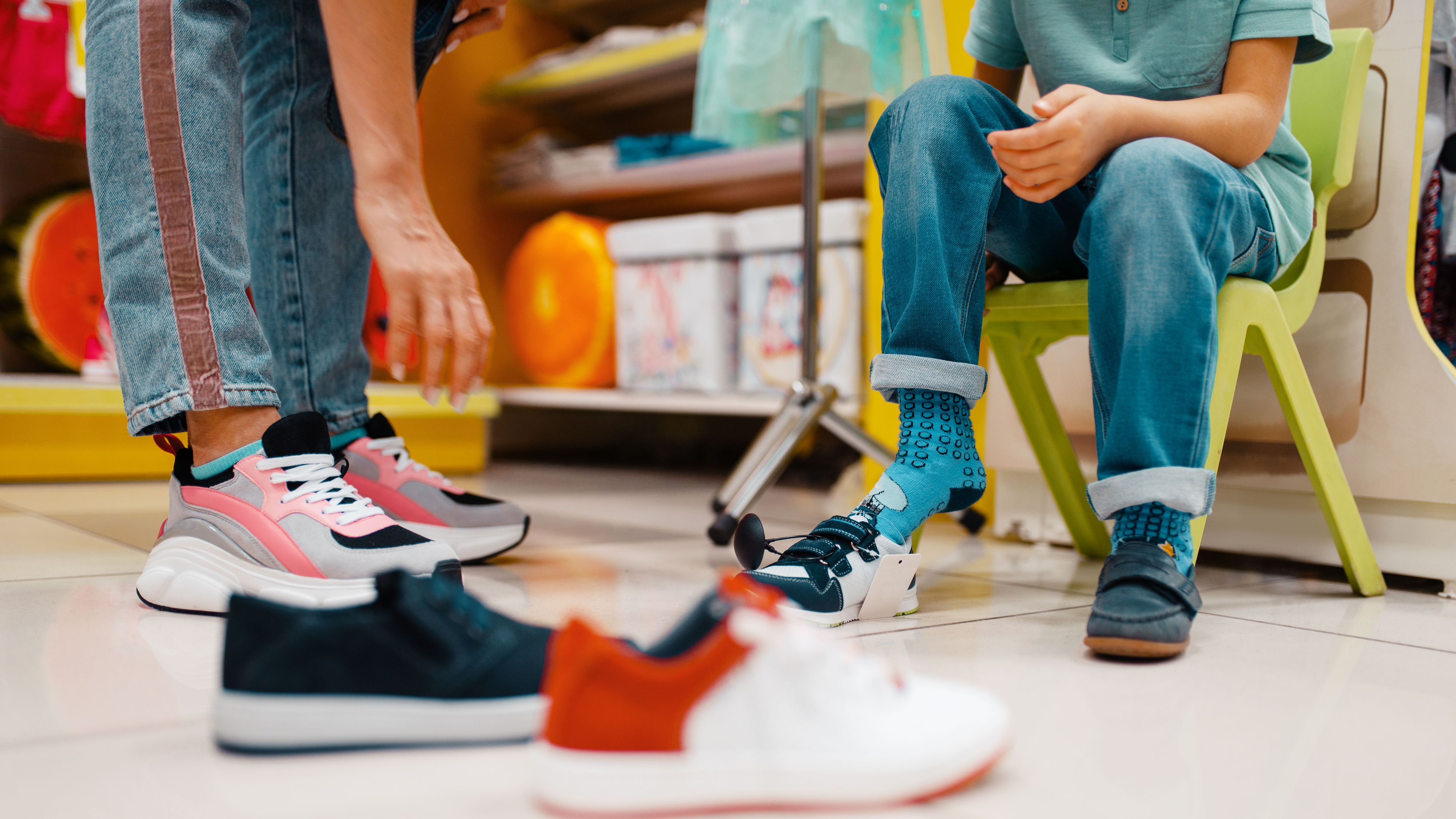 A customer tries on sneakers.