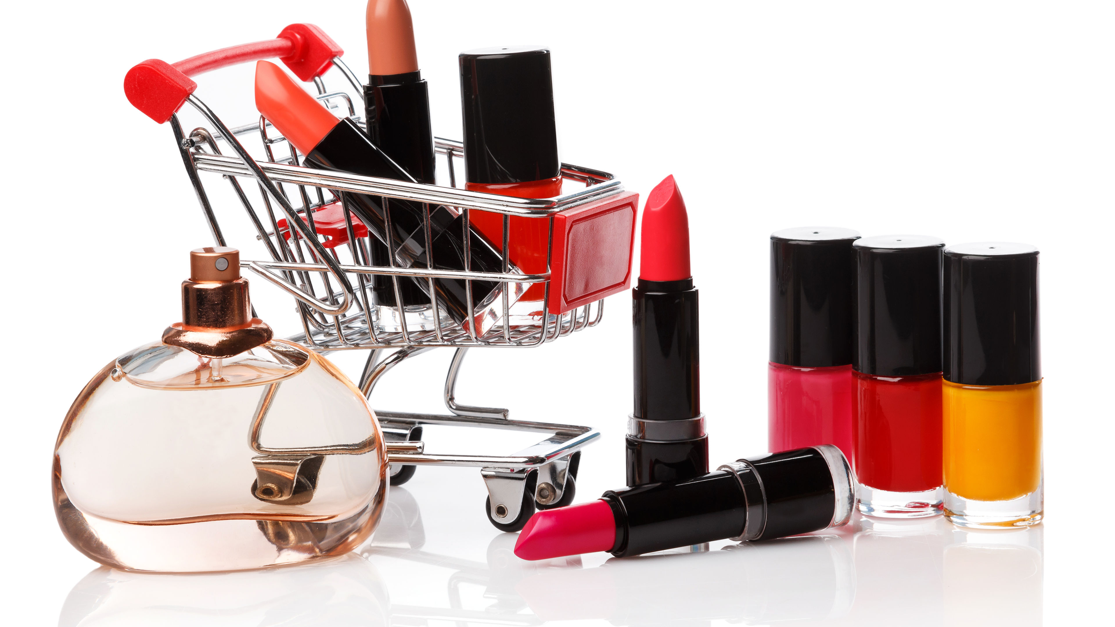 Miniature shopping trolley with makeup essentials.