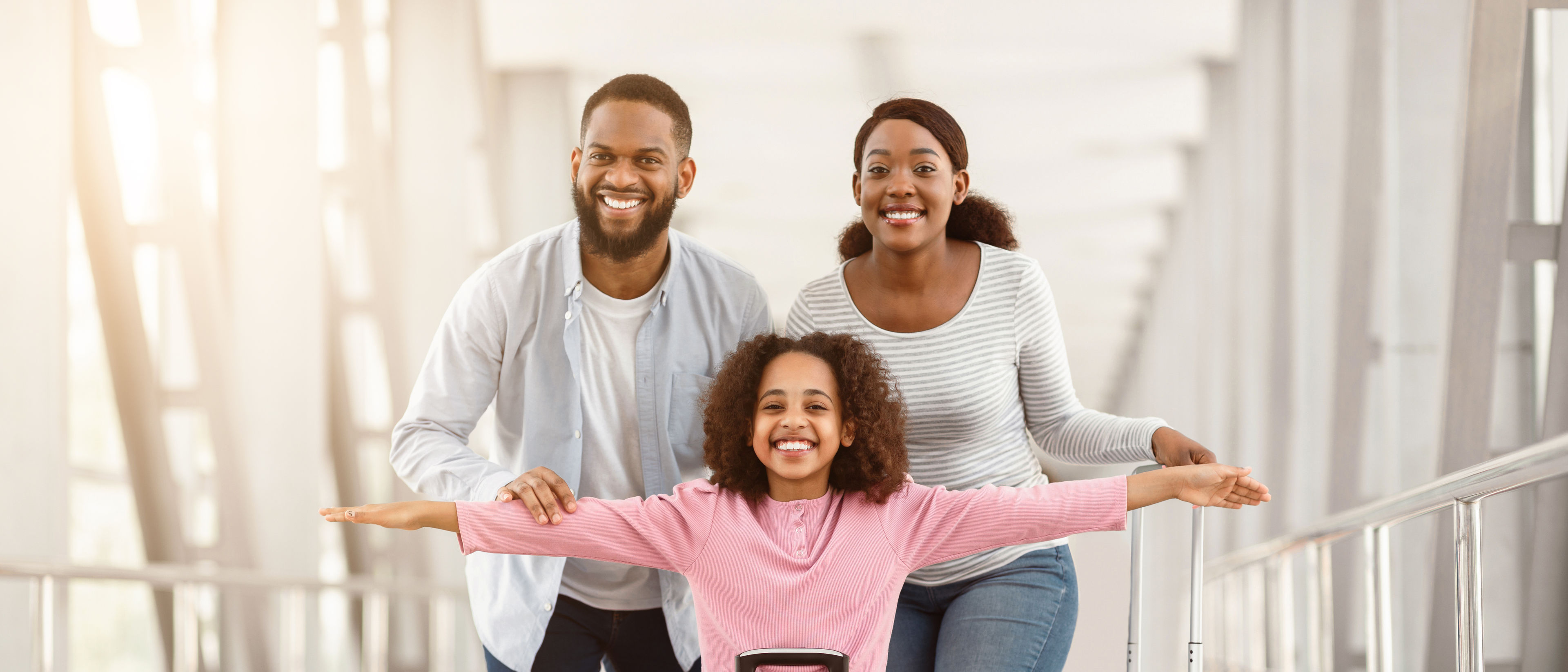 Family with travel suitcases