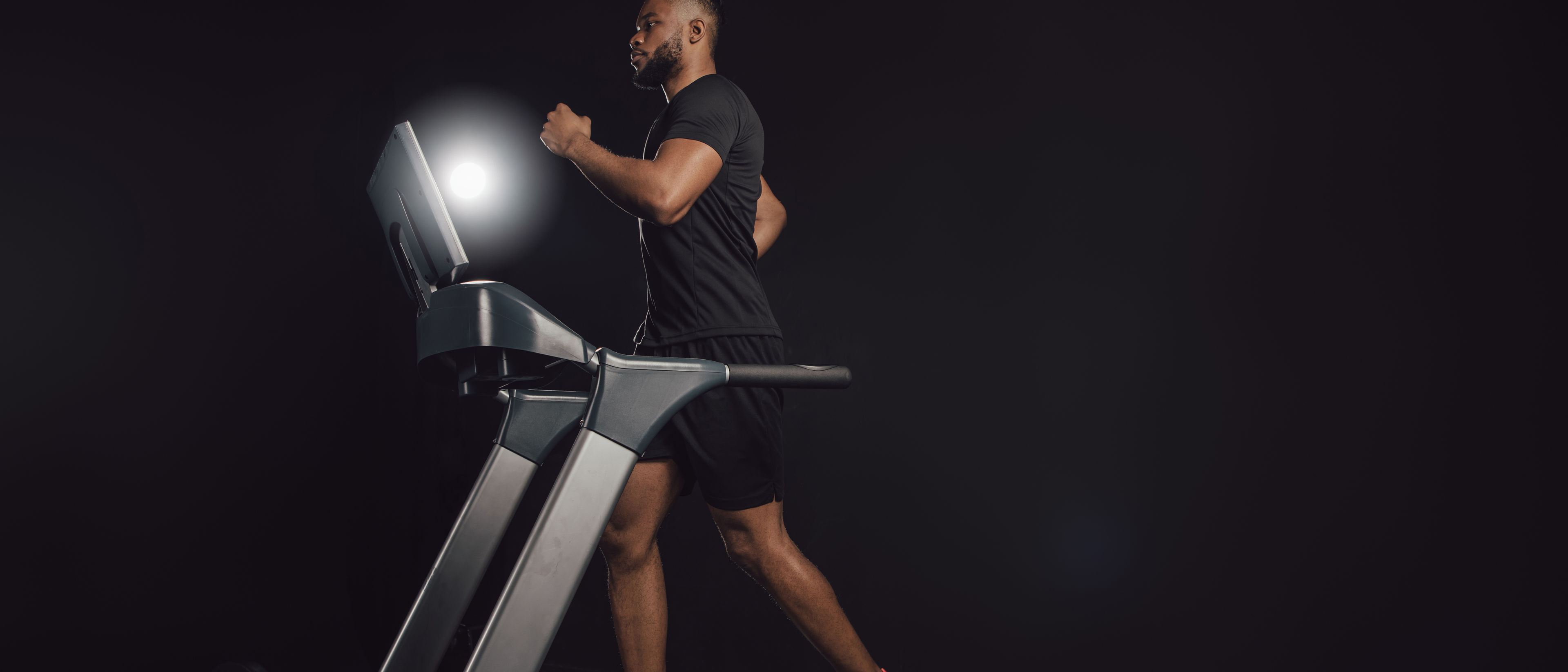 Young man in a treadmill