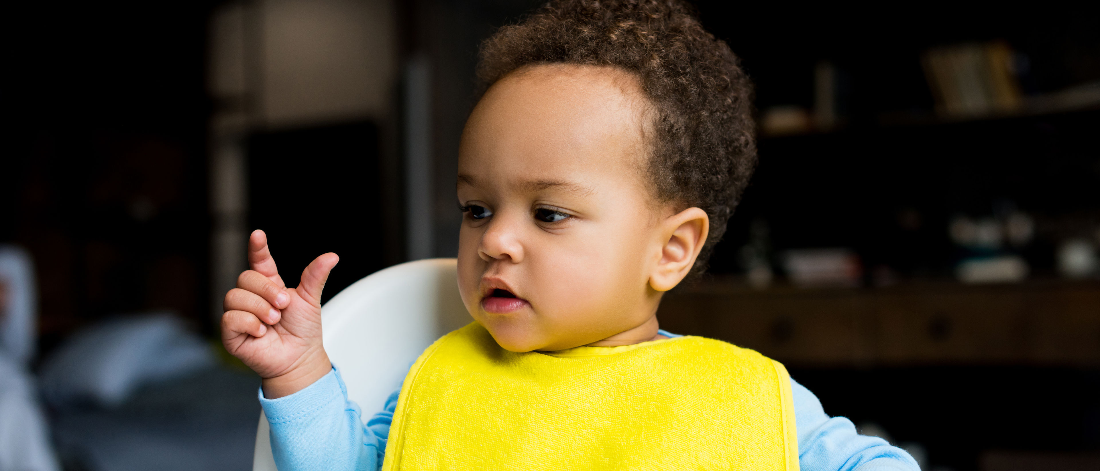 Little boy sitting on a chair