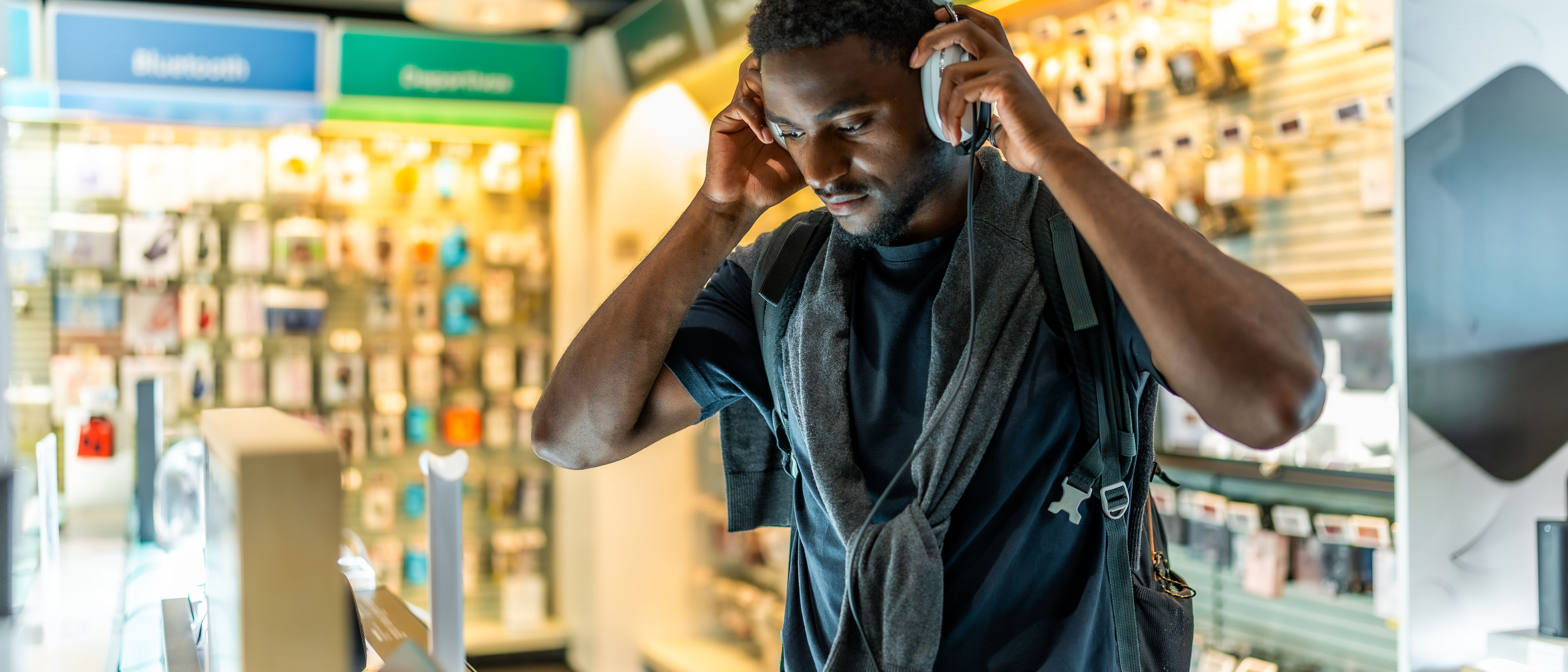 Man checking new headphone