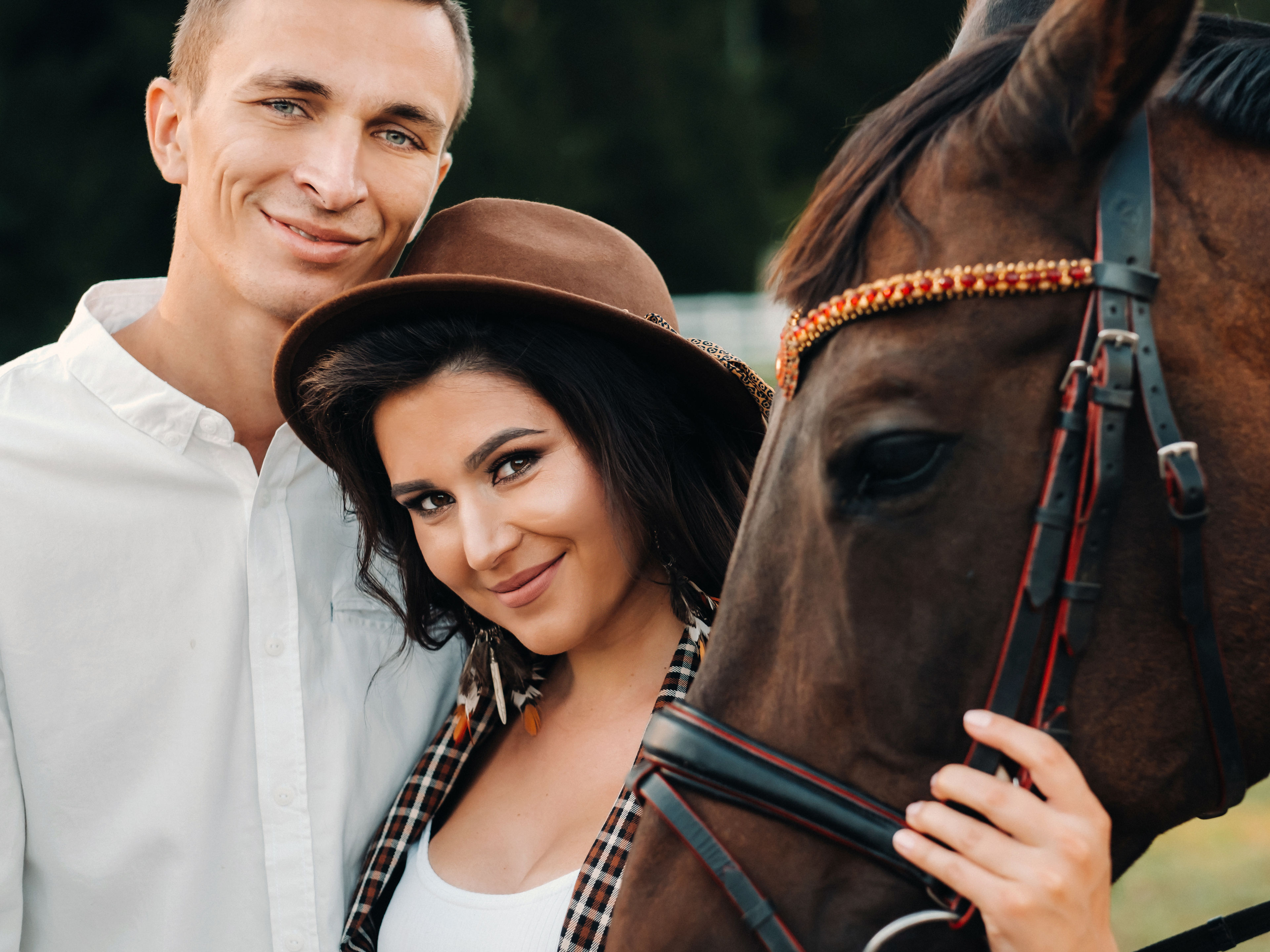A couple near a horse