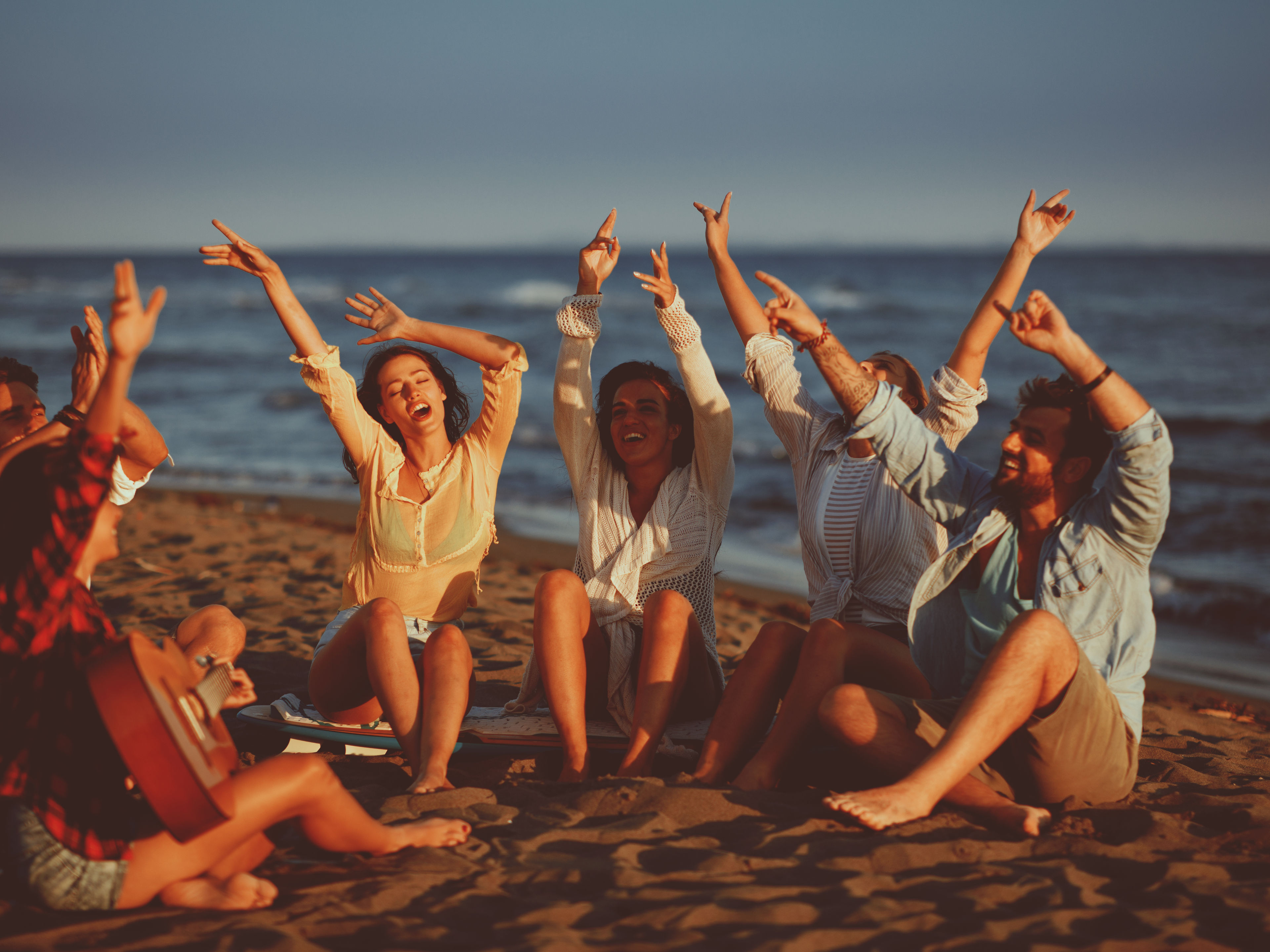 Friends enjoying on a beachside
