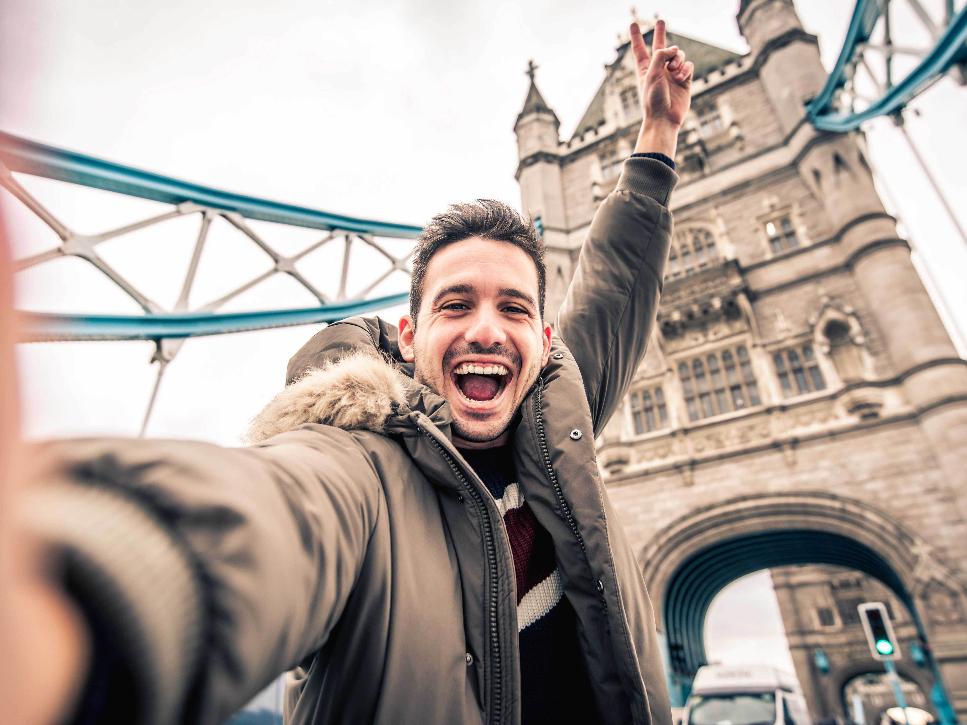 Man smiling and taking selfie