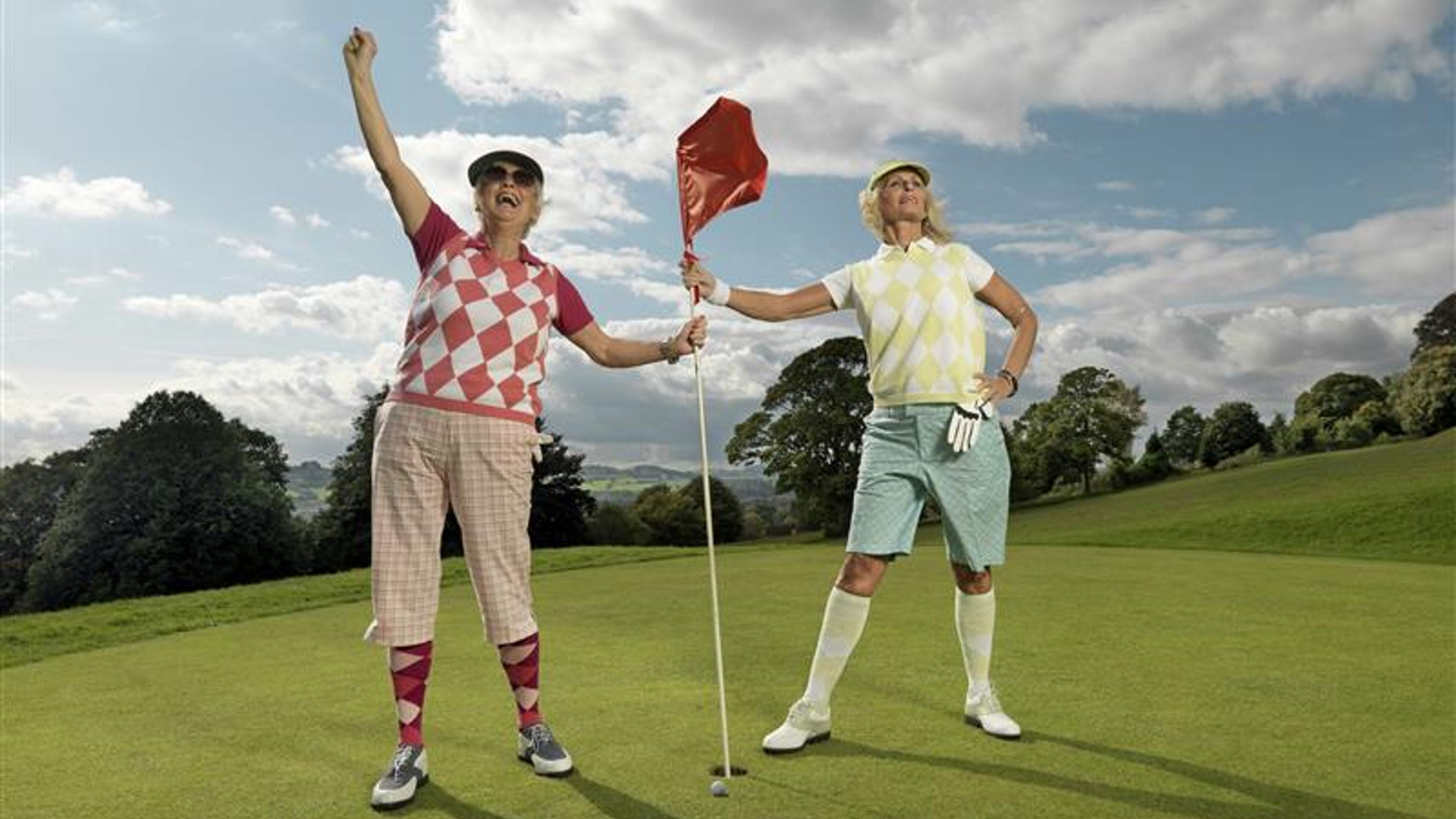 Mature ladies playing golf